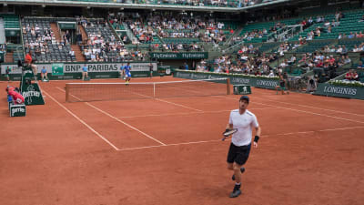 Andy Murray och Juan Del Potro på tennisplanen.