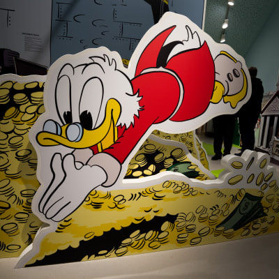 An image shows the cartoon Scrooge McDuck diving into coin piles at the Erika-Fuchs-Haus in Schwarzenbach an der Saale, Germany, 28 July 2015. The first German comic museum is set to open in Schwarzenbach on 01 August.