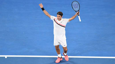 Roger Federer jublar efter sin 20:e seger i en grand slam-turnering.
