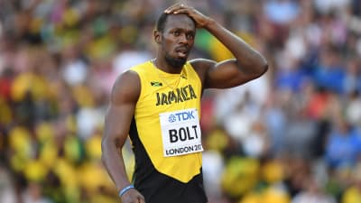 Usain Bolt håller sig för huvudet
