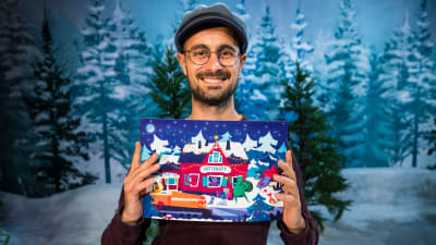 Konstnär Albert Pinilla med BUU-klubbens pappersjulkalender 2019