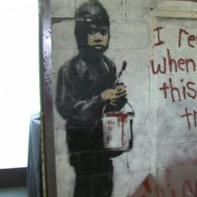 Banksyn seinämaalaus.