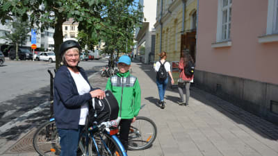 Two cyclists, a woman and a boy