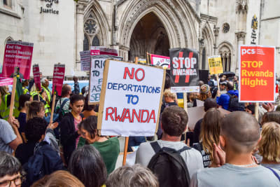 Demonstrators outside Britain's High Court plan to deport asylum seekers to Rwanda.