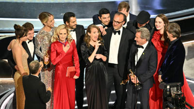 Personerna bakom filmen Coda på Oscarsscenen.