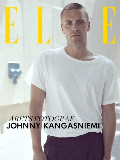 Johnny Kangasniemi. Det står Elle i bakgrunden (bild som visades när han vann priset för Årets fotograf.