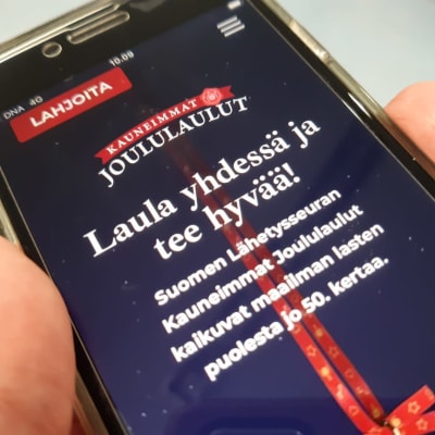 Kauneimmat joululaulut -verkkosivu kännykässä.