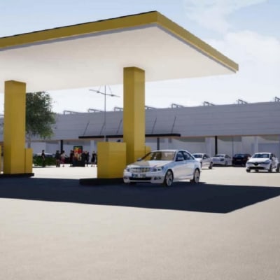 En visualisering av en S-market affär med en bensinmack i förgrunden.