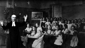 Uno Cygnaeus och en grupp skolelever.