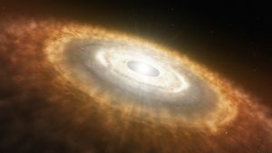 Konstnärens uppfattning av en ung stjärna omgiven av den s.k. protoplanetara skivan som blir till planeter. Konstnärens uppfattning av en ung stjärna omgiven av den så kallade protoplanetariska skivan, som blir till planeter.