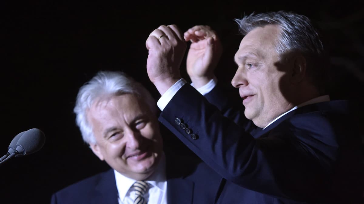 Hungarian Prime Minister and Chairman of Fidesz Party Viktor Orban (R) and Deputy Prime Minister and Chairman of the Christian Democratic Party Zsolt Semjen sing as they celebrate the win of Fidesz and the Christian Democrats at the election night watch event after the general elections in Budapest, Hungary, 08 April 2018.  EPA-