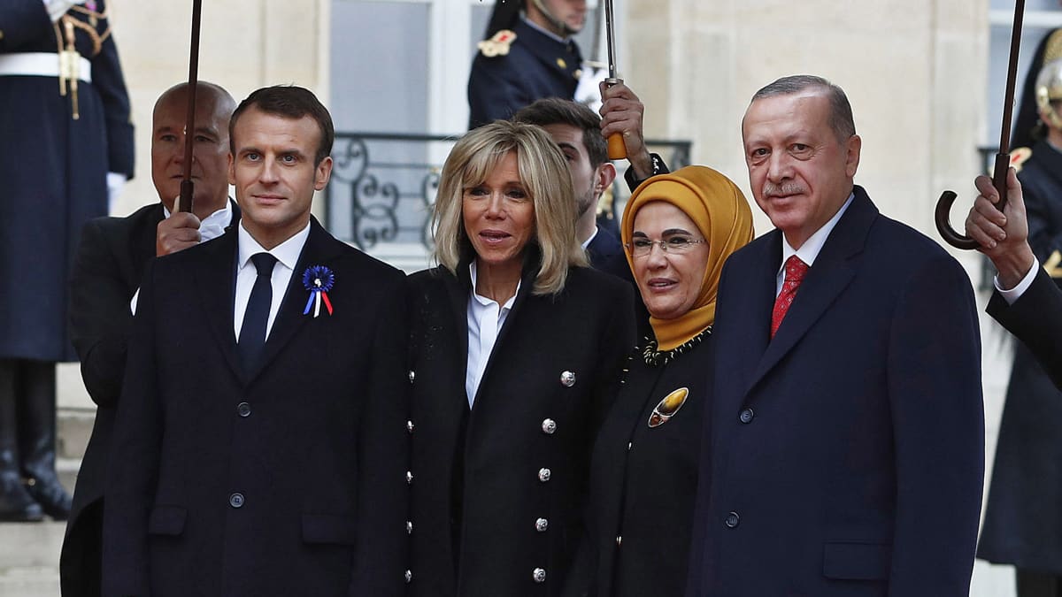 French President Emmanuel Macron (L) and his wife Brigitte Macron (2-L) welcome Turkish President Recep Tayyip Erdogan (R) and his wife Emine Erdogan (2-R) at the Elysee Palace ahead of the international ceremony for the Centenary of the WWI Armistice of 11 November 1918, in Paris, France, 11 November 2018. World leaders have gathered in France to mark the 100th anniversary of the First World War Armistice with services taking place across the world to commemorate the occasion. 
