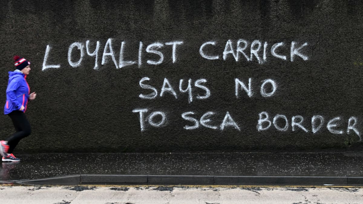Anger at the Irish Sea Border and the Northern Ireland Protocol is rife in loyalist areas of Northern Ireland with graffiti like this example in Carrickfergus, County Antrim appearing on walls across the province.
