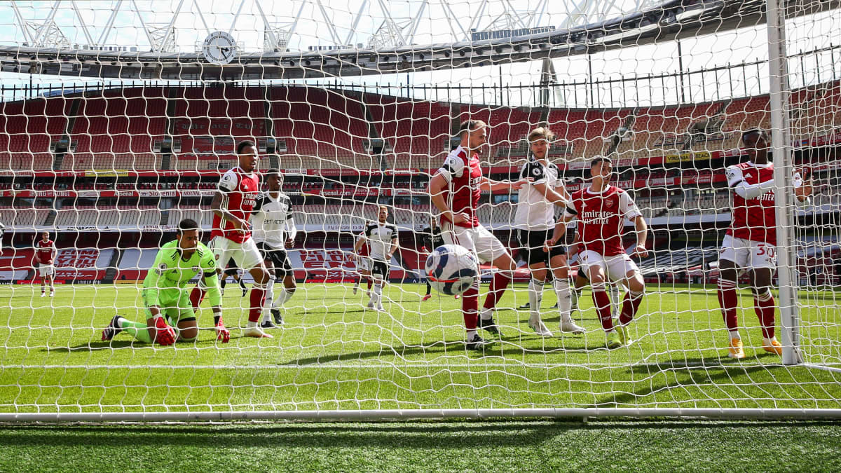 Eddie Nketiah (R) of Arsenal scores the 1-1 equalizer during the English Premier League soccer match between Arsenal FC and Fulham FC in London, Britain, 18 April 2021