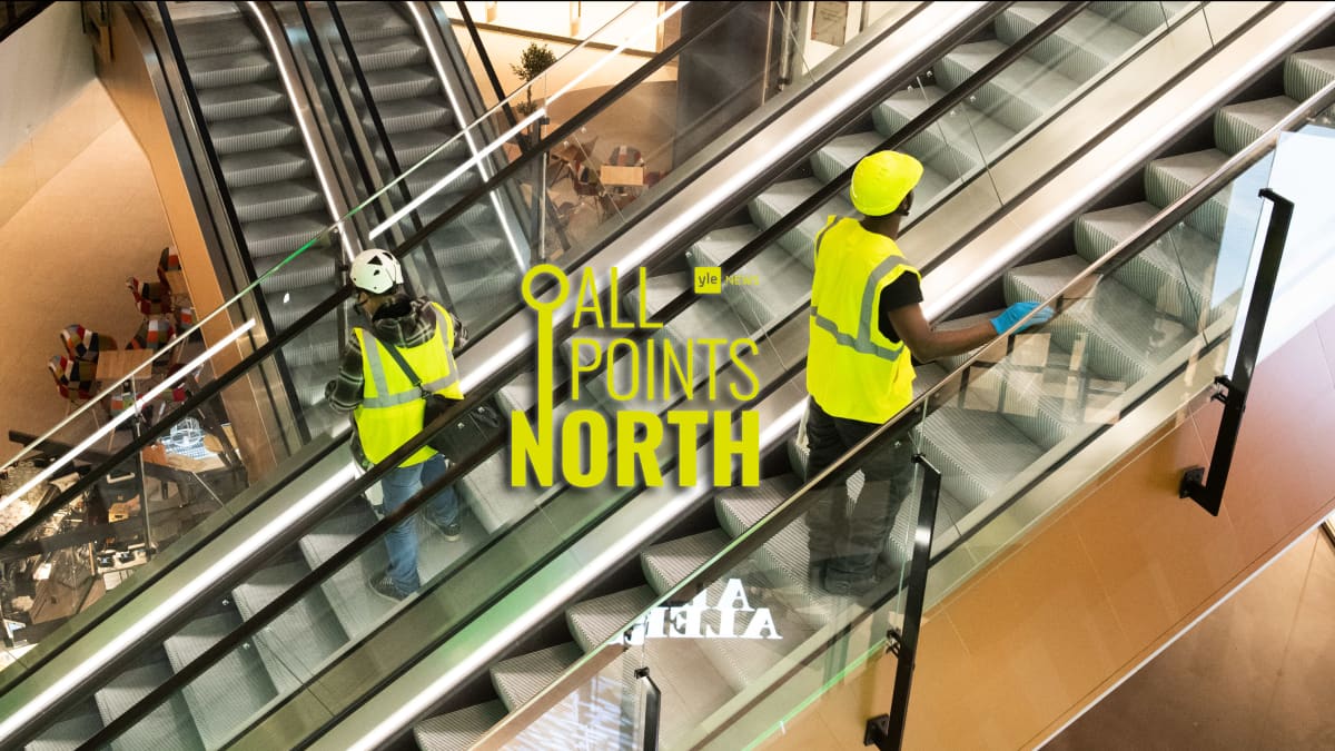 Photo of construction workers on escalators, featuring the All Points North podcast logo.