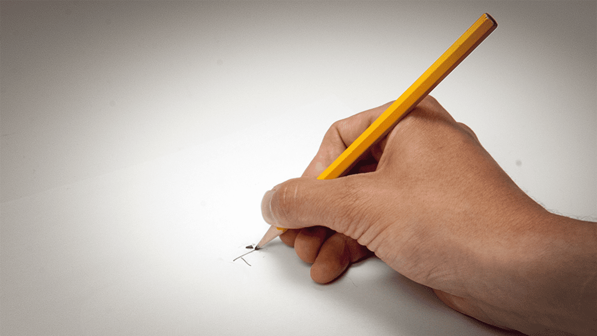 lyijykynällä kirjoittava käsi