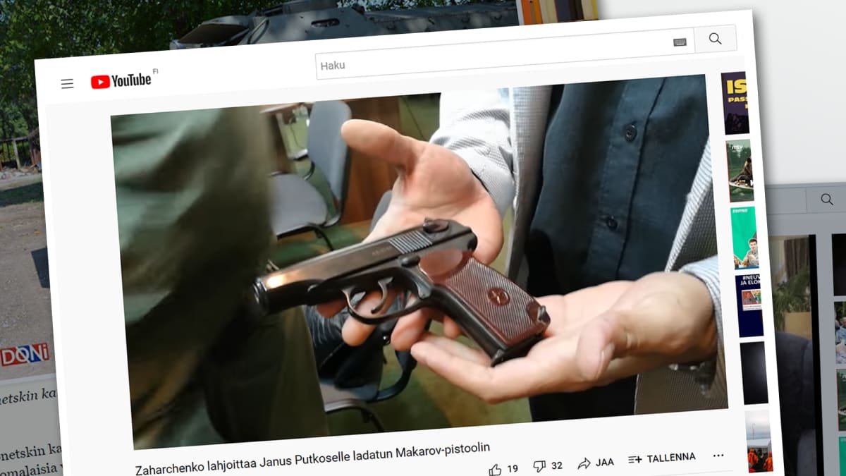 Kuvakaappaus Youtube-videolta, jossa näkyy, kuinka Zahratshenko antaa Janus Putkoselle aseen.