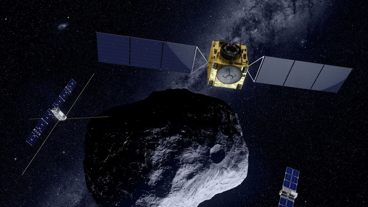 Hera ja sen kumppaneina kulkevat nanosatelliitit Milani ja Juventas tutkimassa asteroidia havainnekuvassa