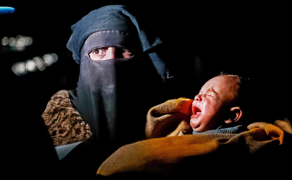 Syyrialainen nainen ja vauva.
