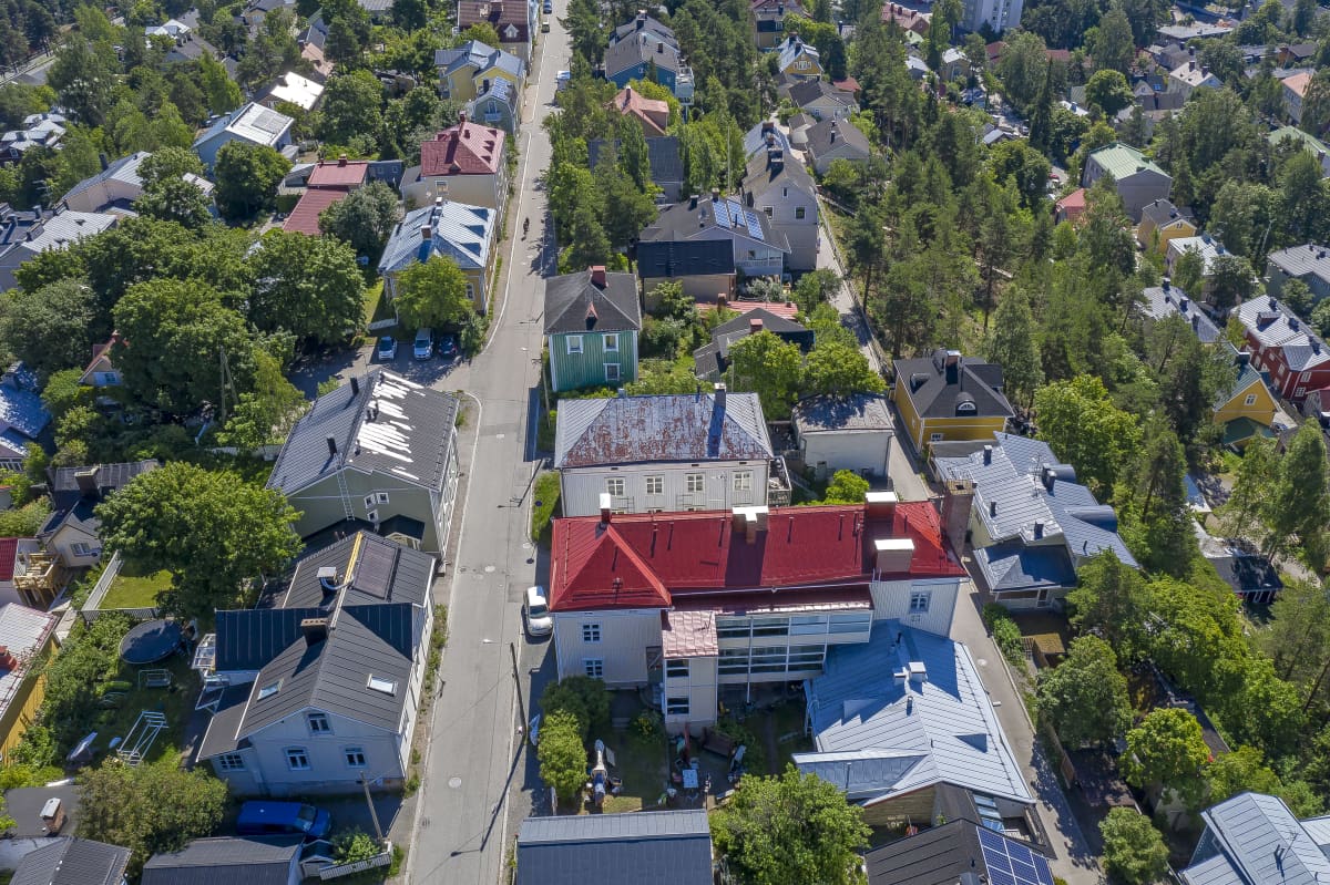 Aerial view of a detached house area.