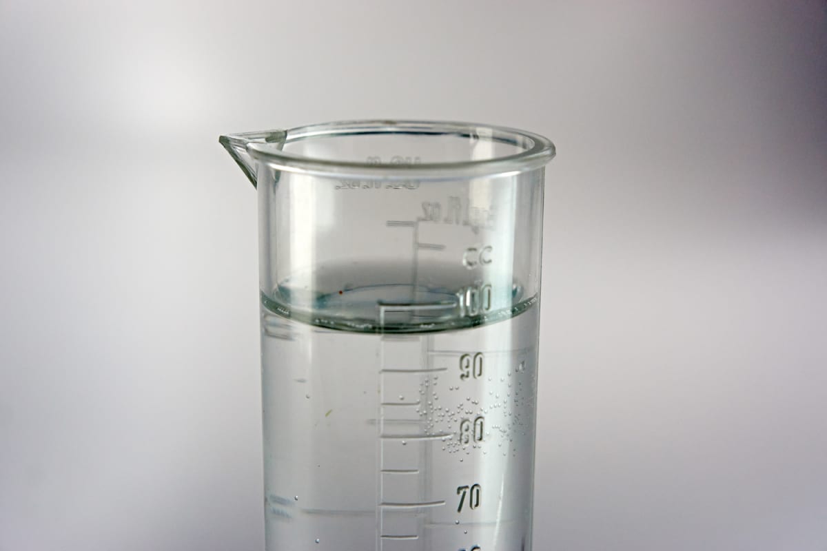 Science beaker with clear fluid.