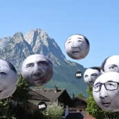 G7-maiden johtajia kuvaavat ilmapallot leijuvat Garmisch-Partenkirchenissä. 
