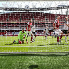 Eddie Nketiah (R) of Arsenal scores the 1-1 equalizer during the English Premier League soccer match between Arsenal FC and Fulham FC in London, Britain, 18 April 2021