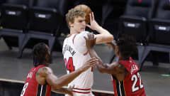  Lauri Markkanen #24 of the Chicago Bulls is defended by Trevor Ariza #8 and Jimmy Butler