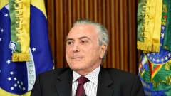 Brasilian presidentti Michel Temer on mietteliään näköinen.
