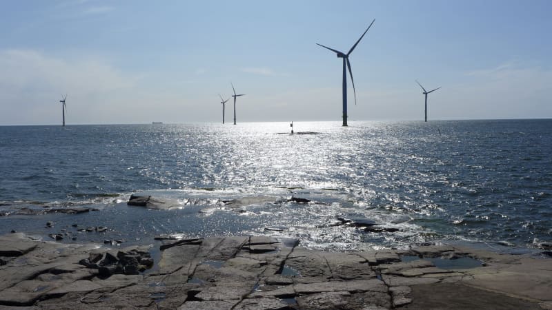 Five offshore wind turbines can be seen on the clear sea in Tahkoluoto, Pori.