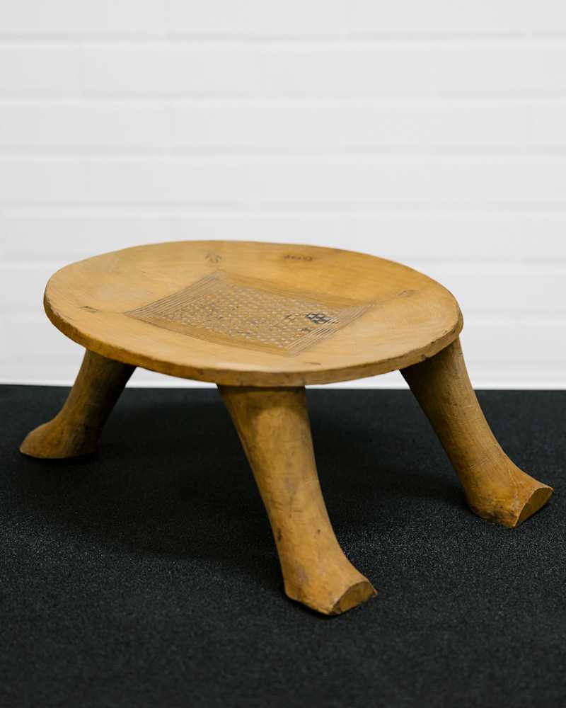 Ancient stool returned to Benin.