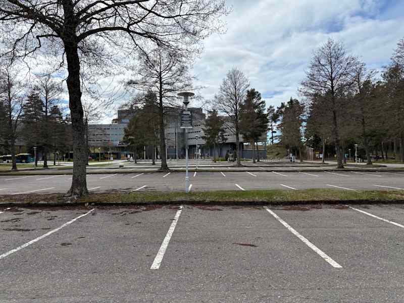 Closed Yyter Spa Hotel farther away.  Empty parking area.