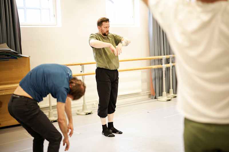 Dancers practice in the dance hall.