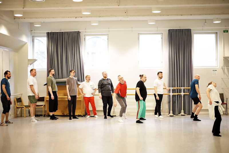 Dancers practice in the dance hall.