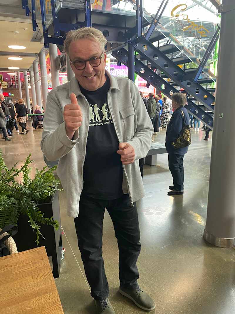 The man shows the thumb for the camera.