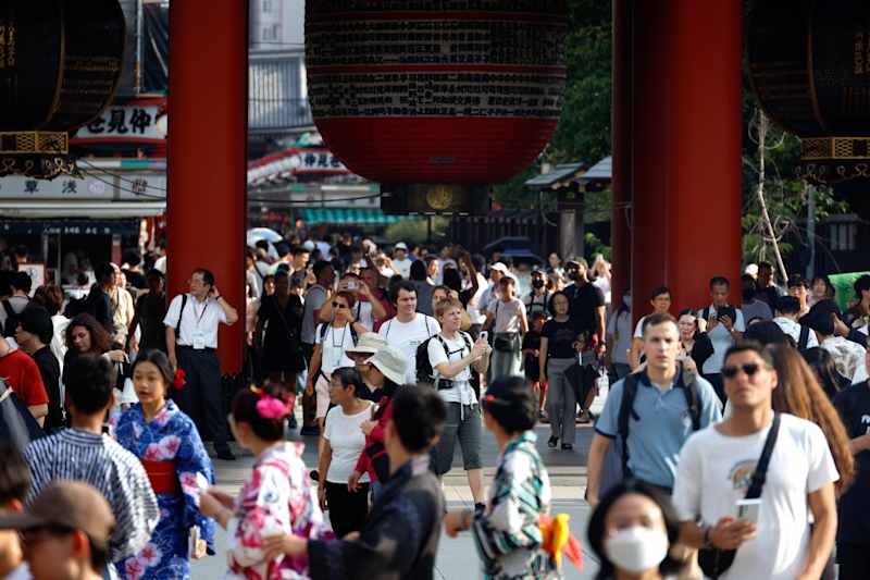 Tourists visit the Sensoji temple in the Asakusa district in Tokyo.