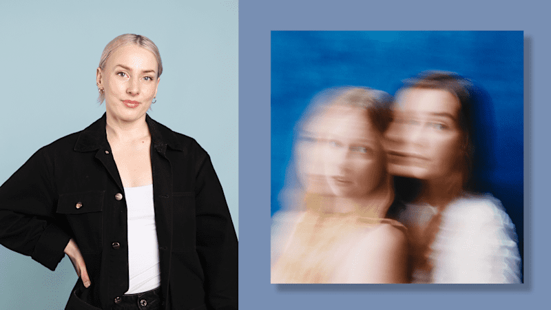 A woman dressed in a black jacket stands with her hand on her hip.  On the right, the cover of the album, with an out-of-focus image of two women looking at the camera.