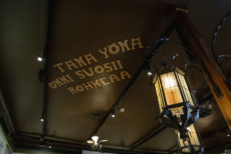 on the ceiling of the restaurant reads the text \