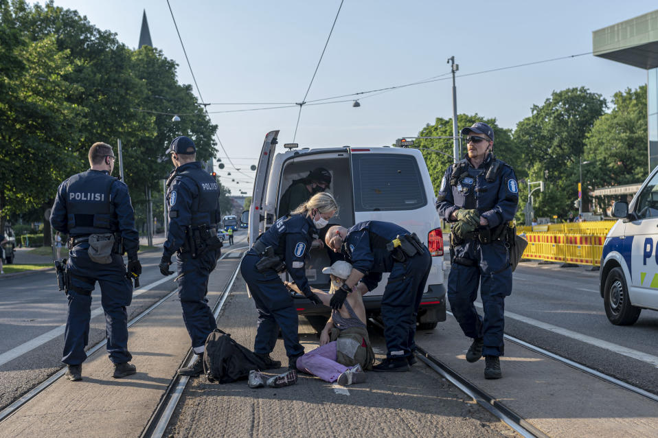 Climate protesters report assault on police arrest
