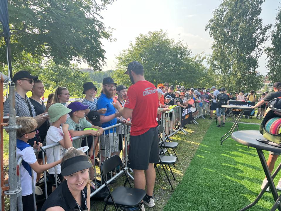 Brodie Smith signs fans discs after his round on Friday at the Disc Golf European Open.