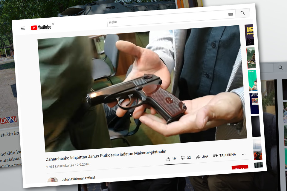 Kuvakaappaus Youtube-videolta, jossa näkyy, kuinka Zahratshenko antaa Janus Putkoselle aseen.