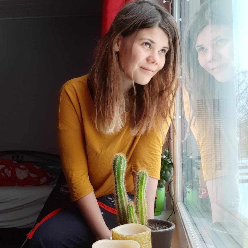 Ruut Luoto sitting by a window